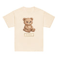 Signature Teddy Kids Tee with JL Gallery Mark laid flat with gold JL Gallery mark